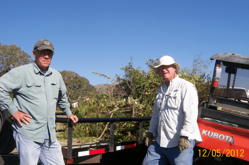 Ron Smudy and Fred Lanoue prepare to haul cleared brush