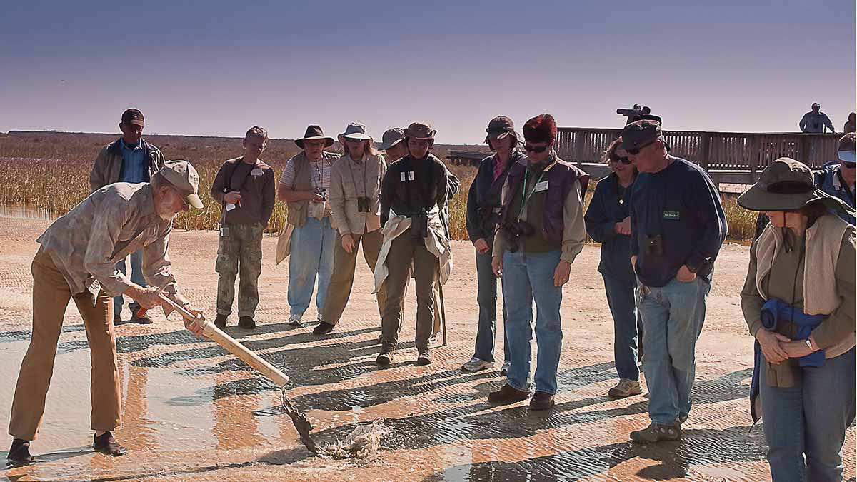 Doc demonstrates how to use a ghost-shrimp pump to learn about critters that live in the swash zone